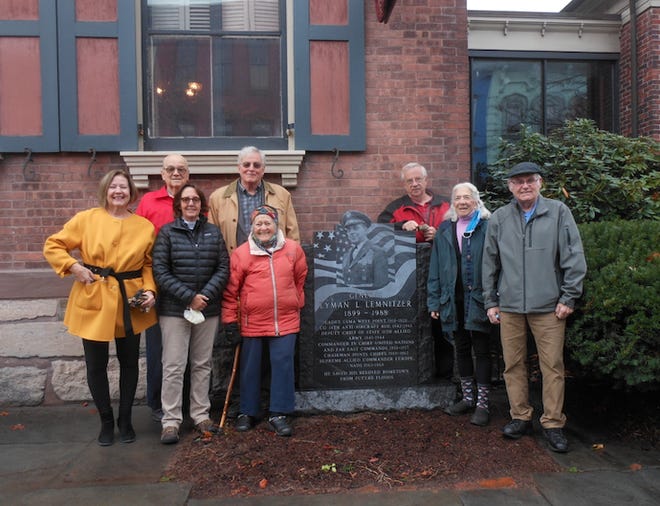 The Planning Group stood by the General Lyman L. Lemnitzer Memorial that was installed at the Wayne County Historical Society in Honesdale, the week of Oct. 26. From left, front row: Patti Bursis; Chairperson Paula Roos; Martha Sader; Roger Herman, WCHS Trustee. Back row: Nancy Carmody,  WCHS Trustee; Albert G. Rutherford; Robert Keen; Stanton Pratt,  WCHS Trustee. Absent from picture: Wendell Kay and Warren Schlosser.